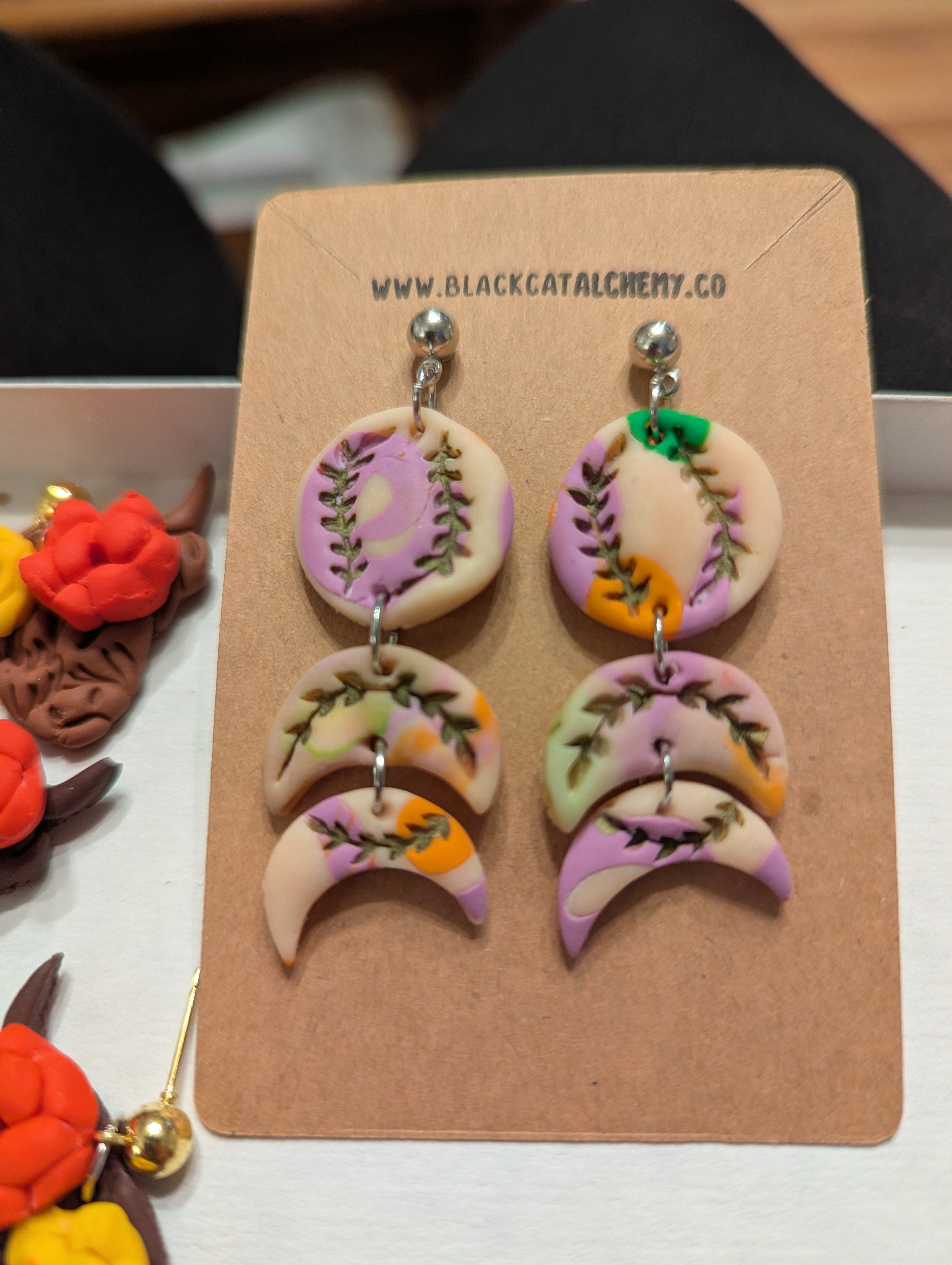 One-of-a-kind moon phase earrings handmade from lightweight polymer clay with celestial lunar design