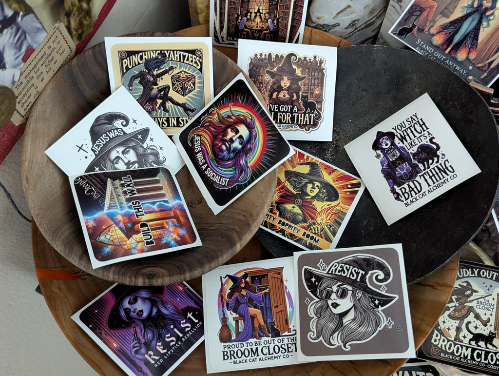 Politically charged witchy sticker set featuring rebellious and magical designs, including resistance-themed witchcraft imagery printed on durable vinyl stickers.