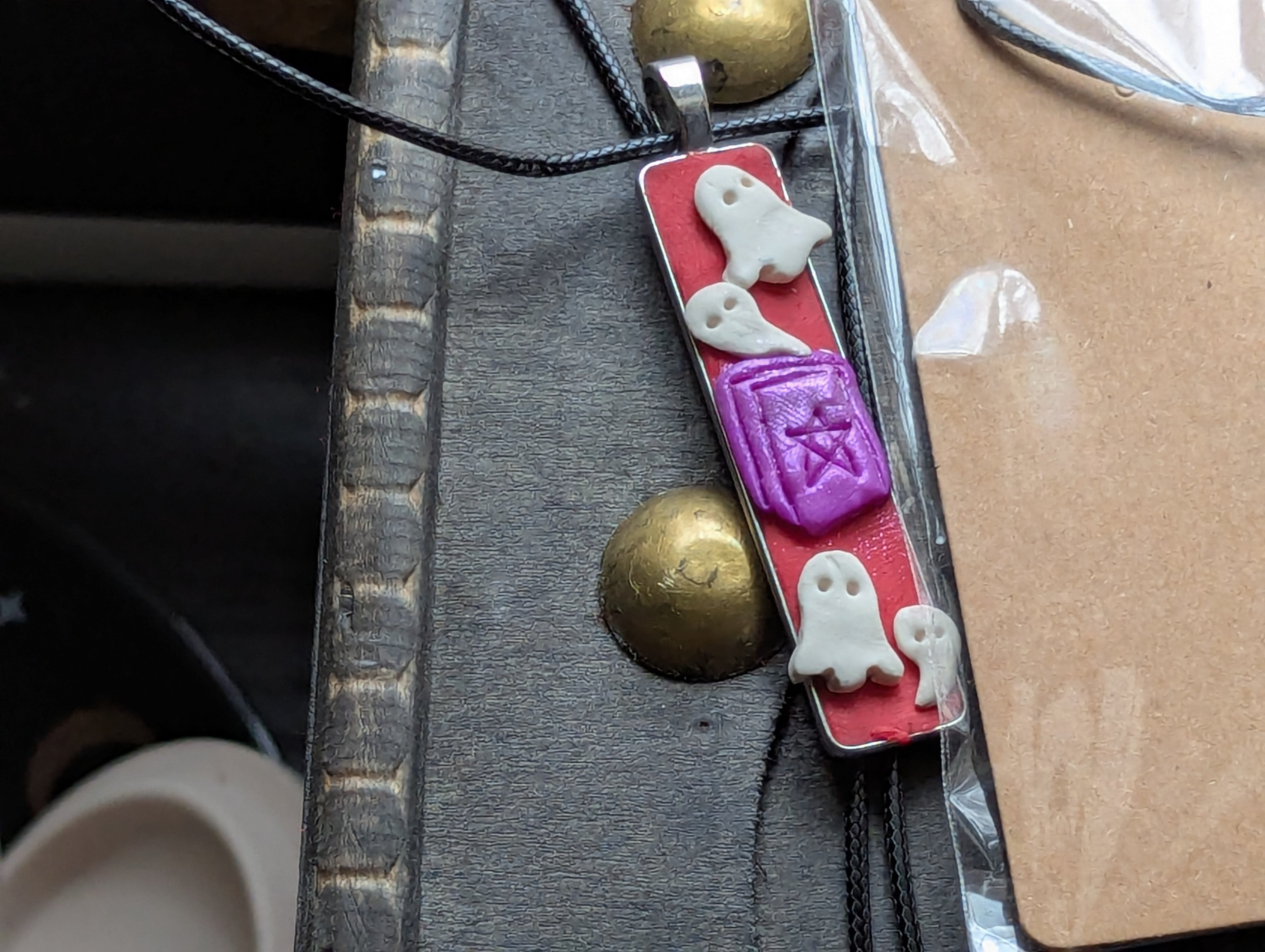 Handmade clay necklace inspired by Dungeons and Dragons speak with dead spell