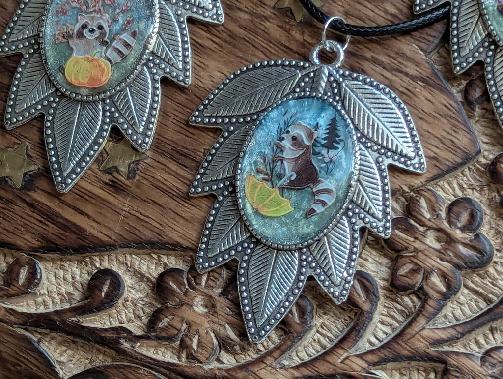 Cottagecore raccoon jewelry with resin and garden details