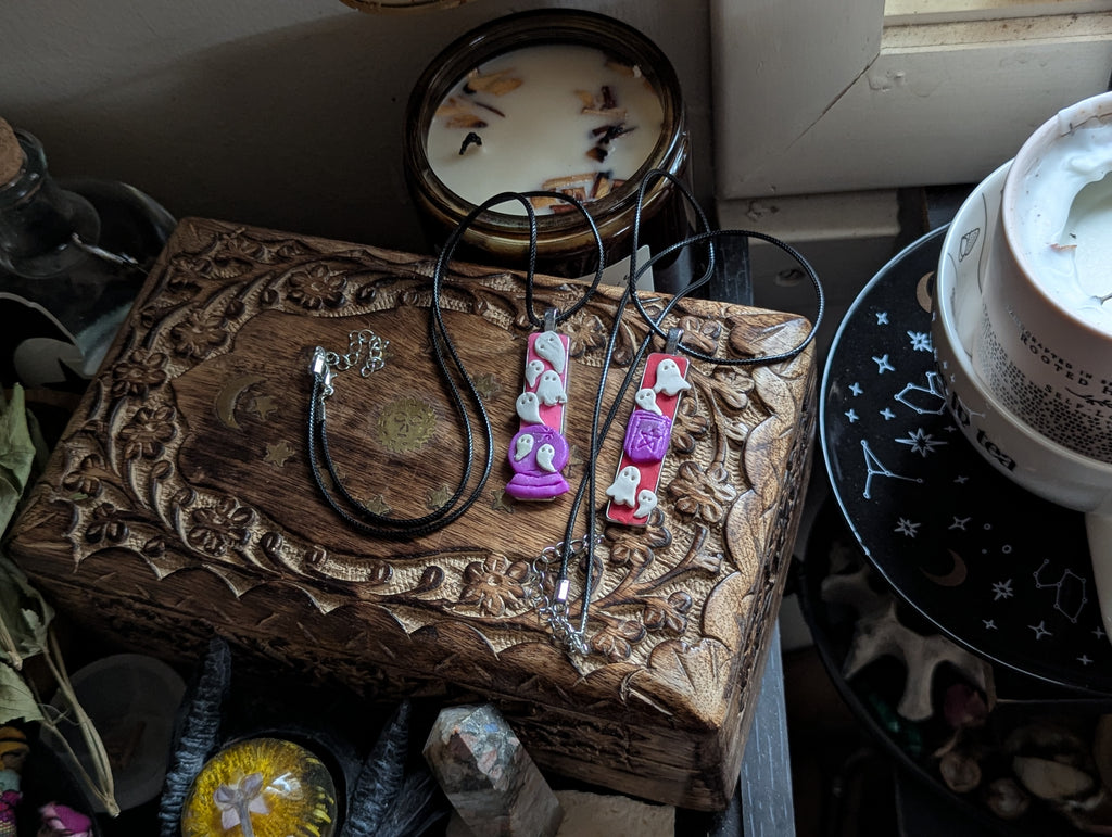 Hand sculpted clay speak with dead statement necklace with gothic symbolism