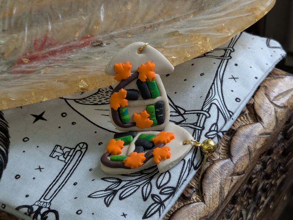 Mushroom bookshelf earrings with whimsical forest-inspired design and hypoallergenic posts