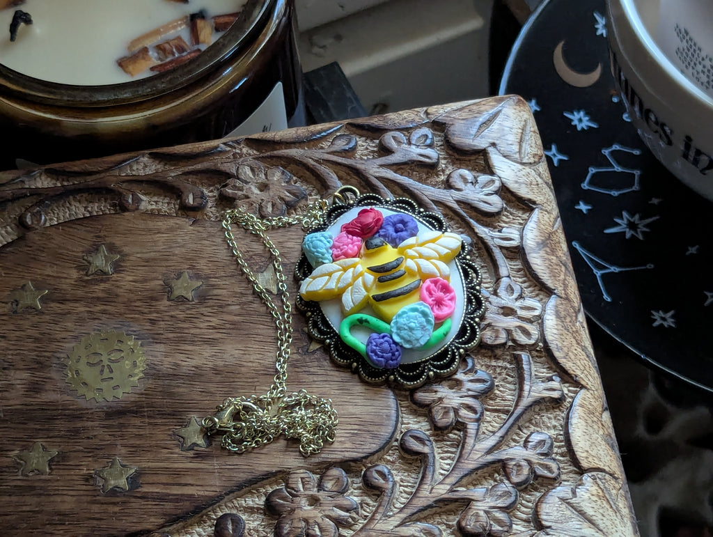 Hand sculpted clay bee statement necklace with magical nature aesthetic