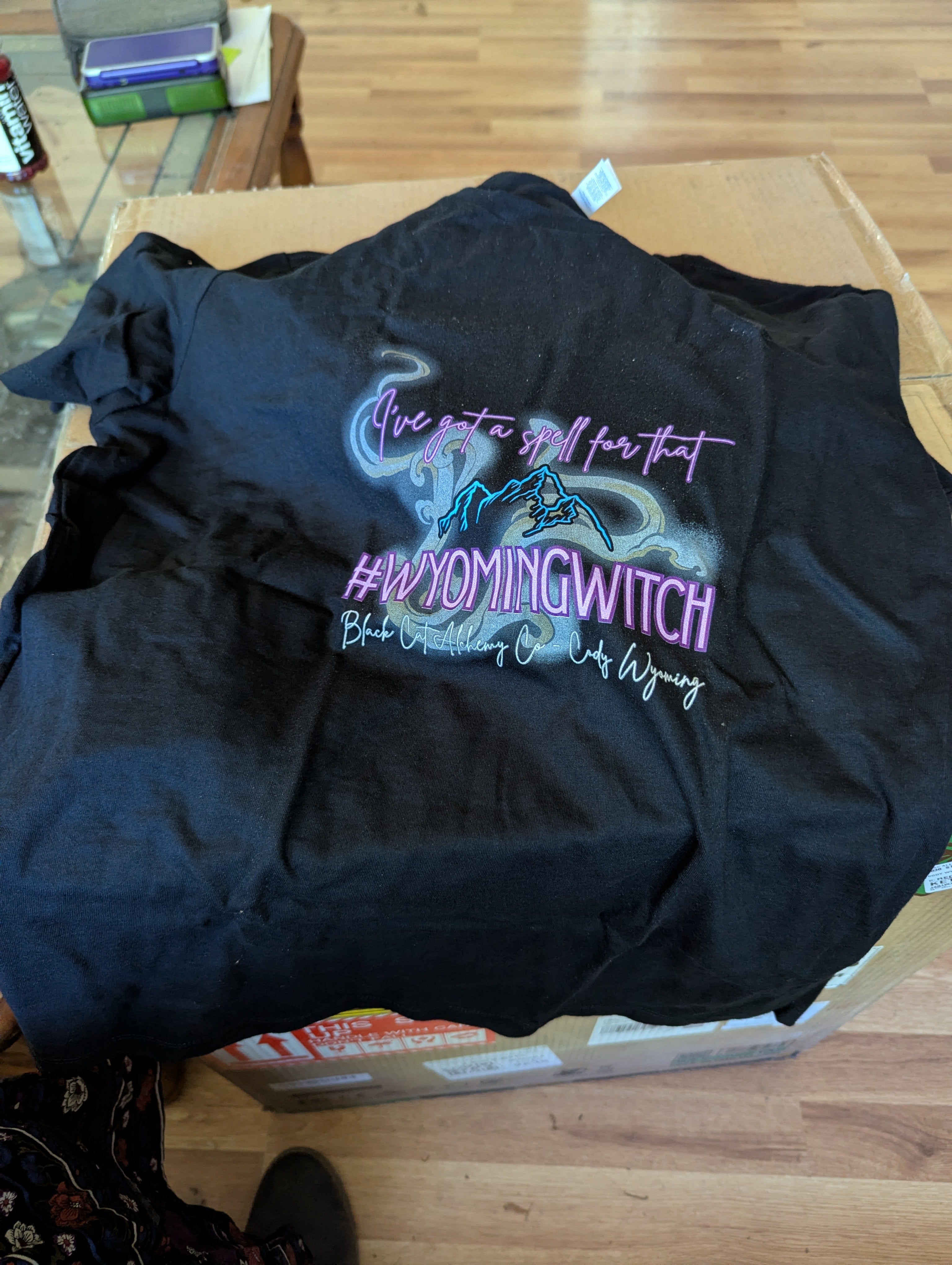 Black t-shirt featuring the phrase "I've got a spell for that" "#wyomingwitch" in an exclusive Black Cat Alchemy Company witchy design.