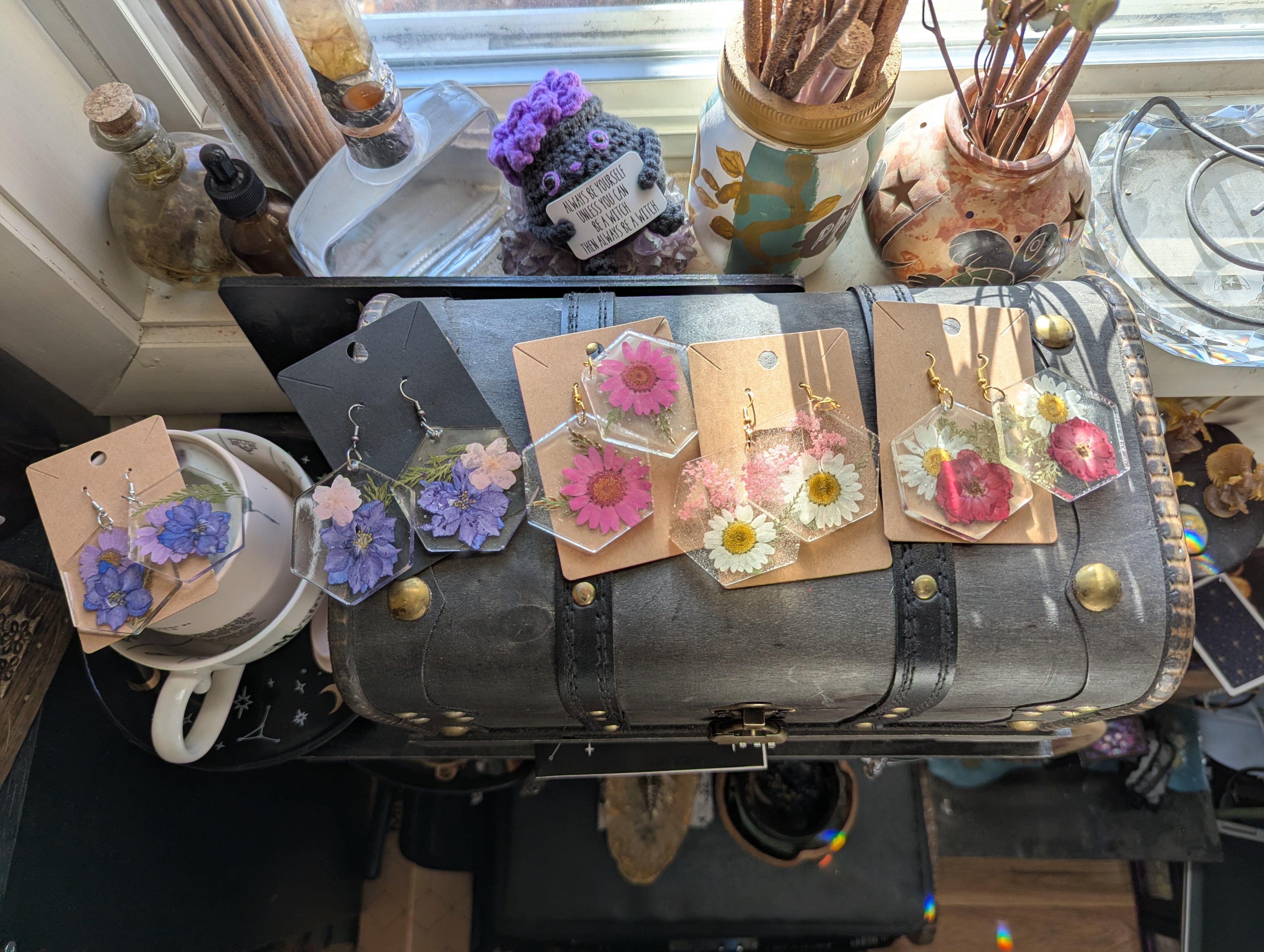 Large pressed flower resin earrings on hypoallergenic hooks with vibrant floral design